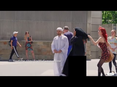 شاهد مواطنة أجنبية تسحب الحجاب عن امراة عربية أمام زوجها