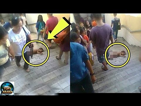 شاهد مارة يتجاهلون طفلًا ملقى على درج المترو